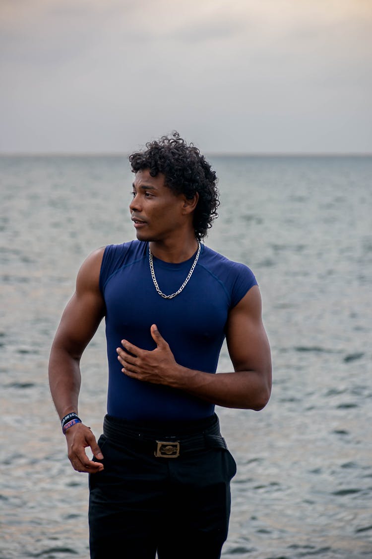 Young Man Posing In Blue Sleeveless Compression T-Shirt