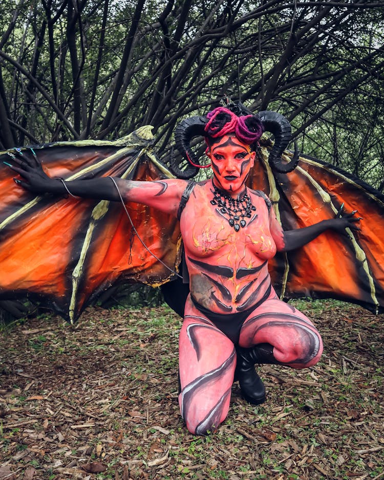 Woman In Devil Costume With Wings