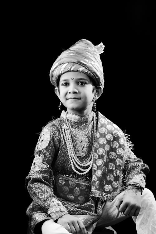 Boy in Traditional Clothing in Black and White