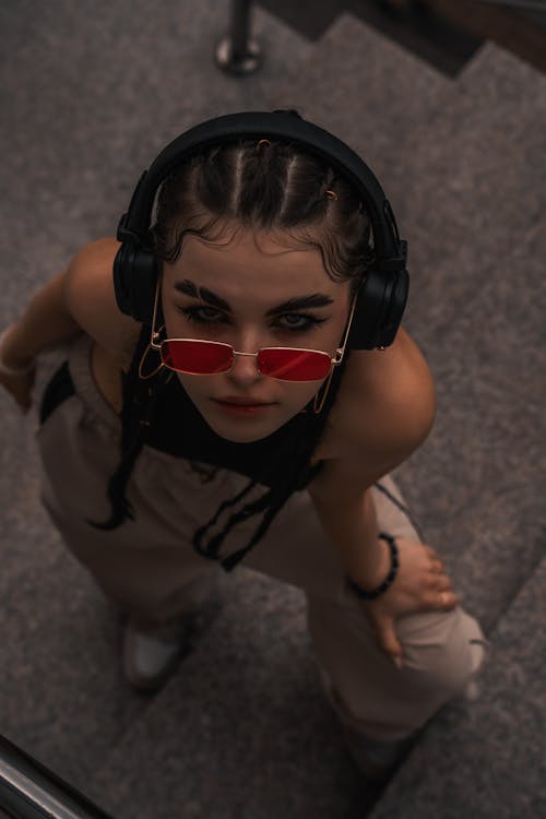 Woman Wearing Headphones on a Street