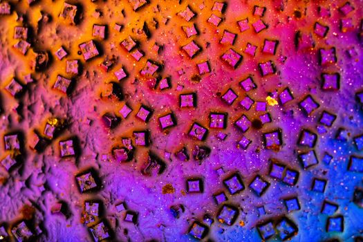 Colorful abstract artwork featuring vivid geometric squares in a dynamic pattern.