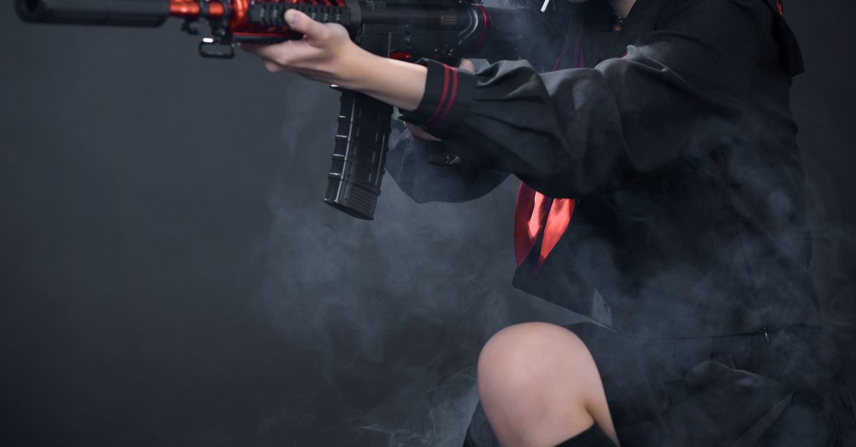 Cosplay Hunting Rifle Young Woman in a Cosplay Holding a Rifle · Free Stock Photo