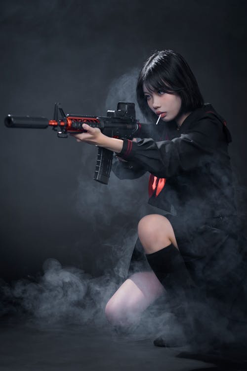 Young Woman in a Cosplay Holding a Rifle · Free Stock Photo