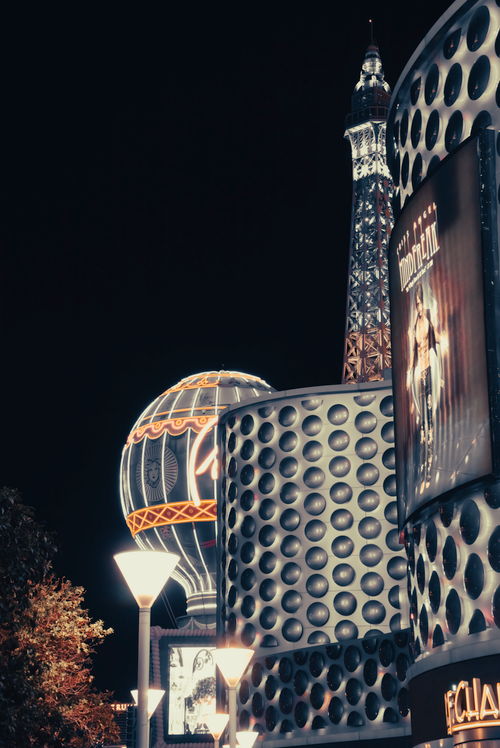 Free Night view of the illuminated Eiffel Tower replica in Las Vegas, showcasing modern architecture and vibrant city lights. Stock Photo