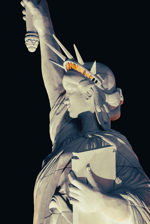 Free Dramatic night view of the Statue of Liberty in New York City, USA. Stock Photo