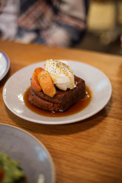 Free Indulge in a delectable French toast topped with poached pears and cream, perfect for breakfast. Stock Photo