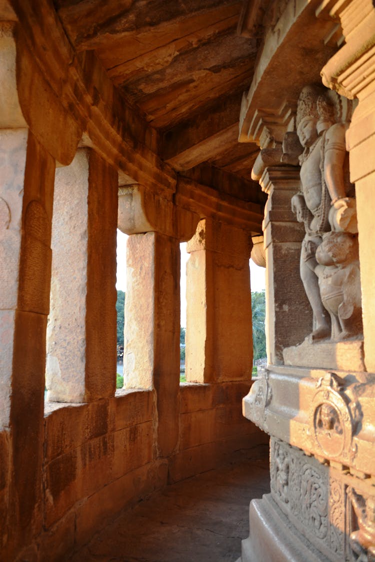 Narrow Corridor With Statues