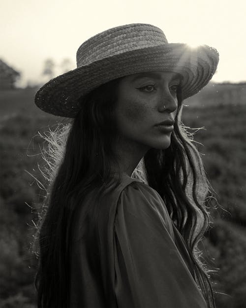 Woman in Hat at Sunset in Black and White