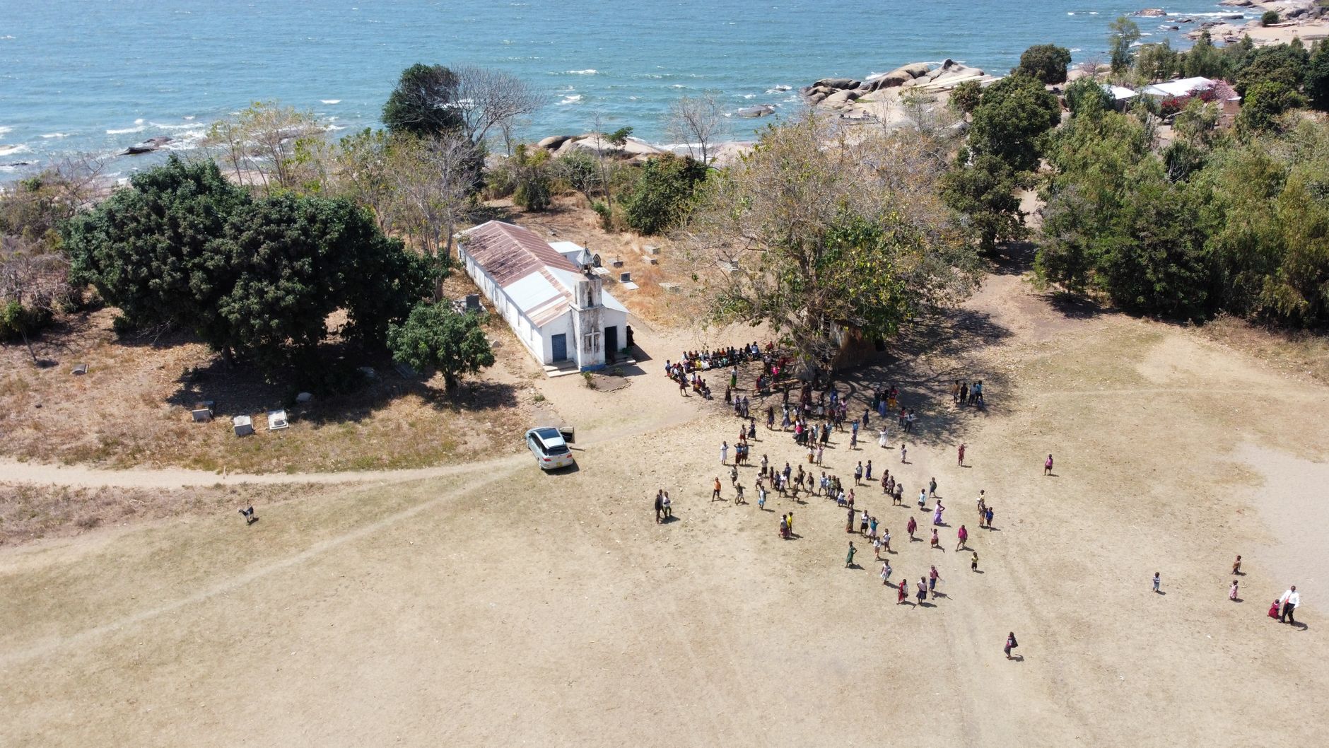 Aerial view of a church gathering by Lake Malawi in Nkhotakota, Central Region.