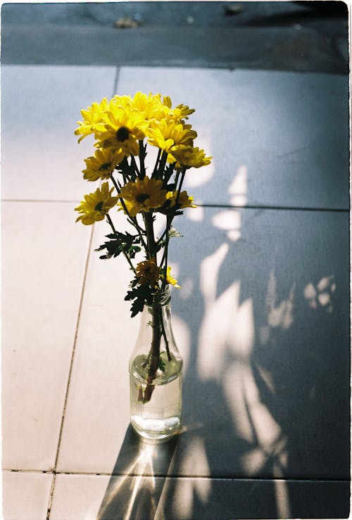 Bottle with Yellow Flowers