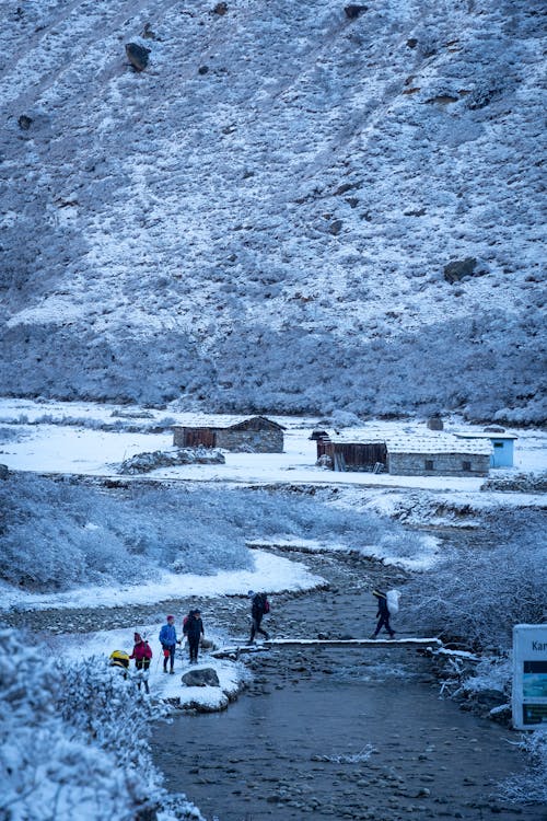 Stream and Village in Winter