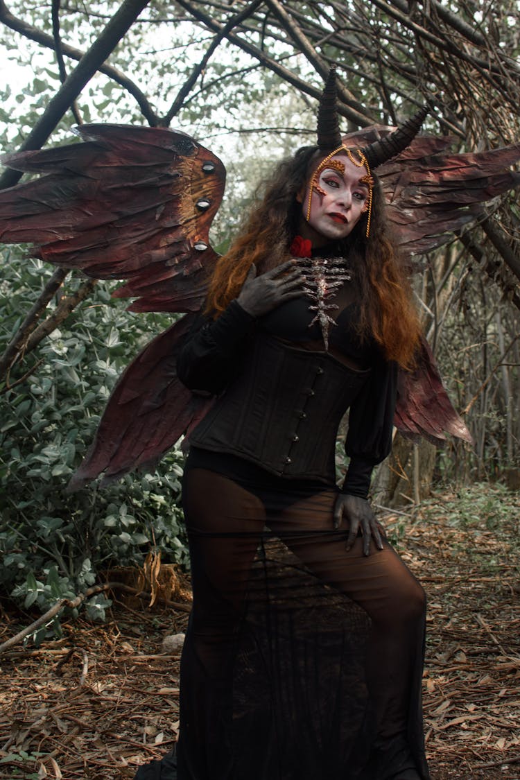 Woman In Devil Costume With Wings