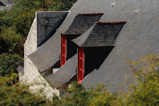 Roof is Covered with Black Tiles with Red Windows