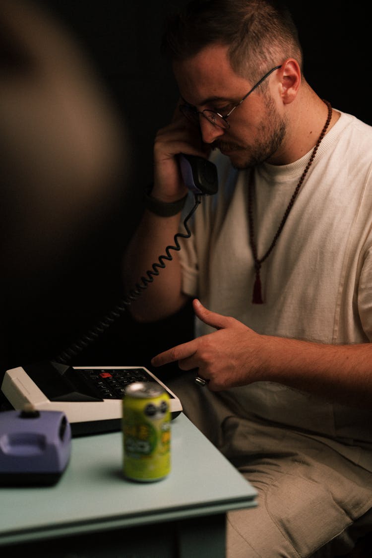 Man Talking On An Analogue Phone