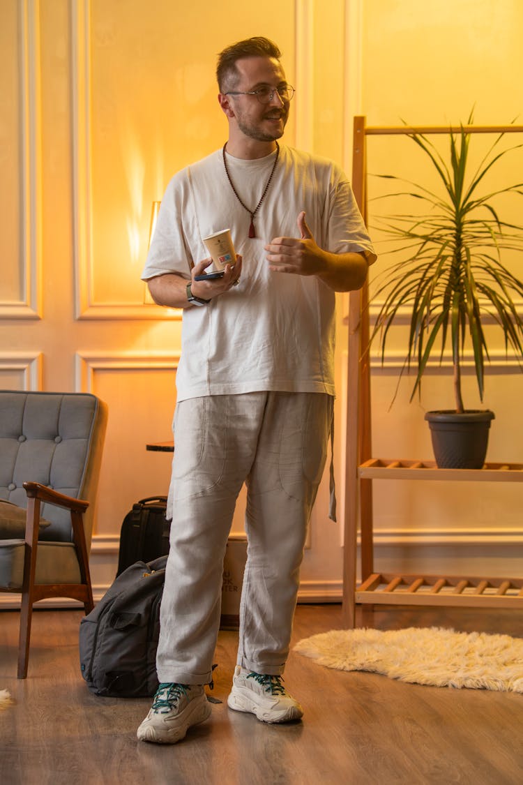 Smiling Man Standing In Room