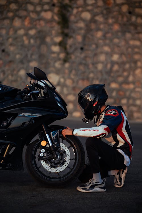 Man Next to a Motorbike