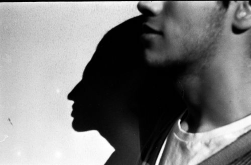 Free Striking black and white portrait of a man's silhouette against a textured background. Stock Photo