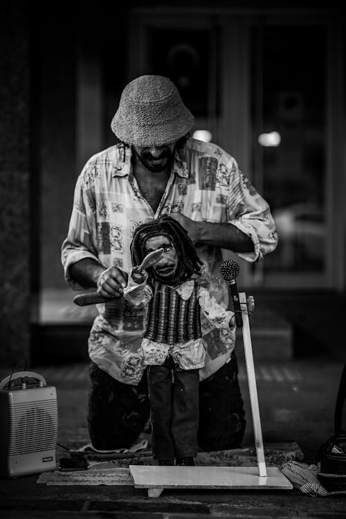 A Man with a Puppet on the Street