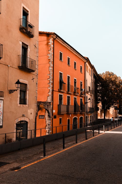 Orange Building by Street in Girona, Spain