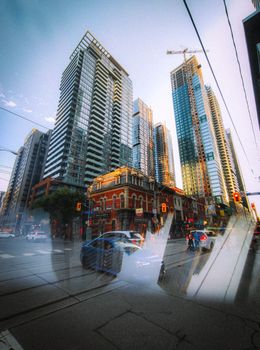 Explore the vibrant energy of a busy urban cityscape with towering skyscrapers and bustling street life.