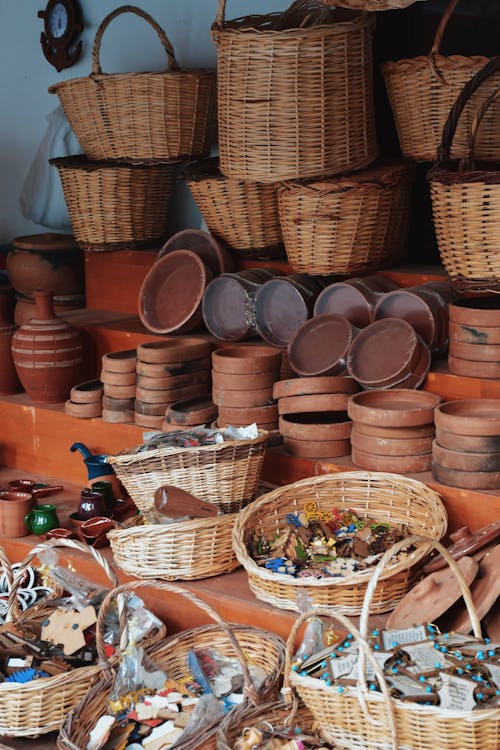 Market Stand with Wicker Baskets Clay Pottery and Souvenirs