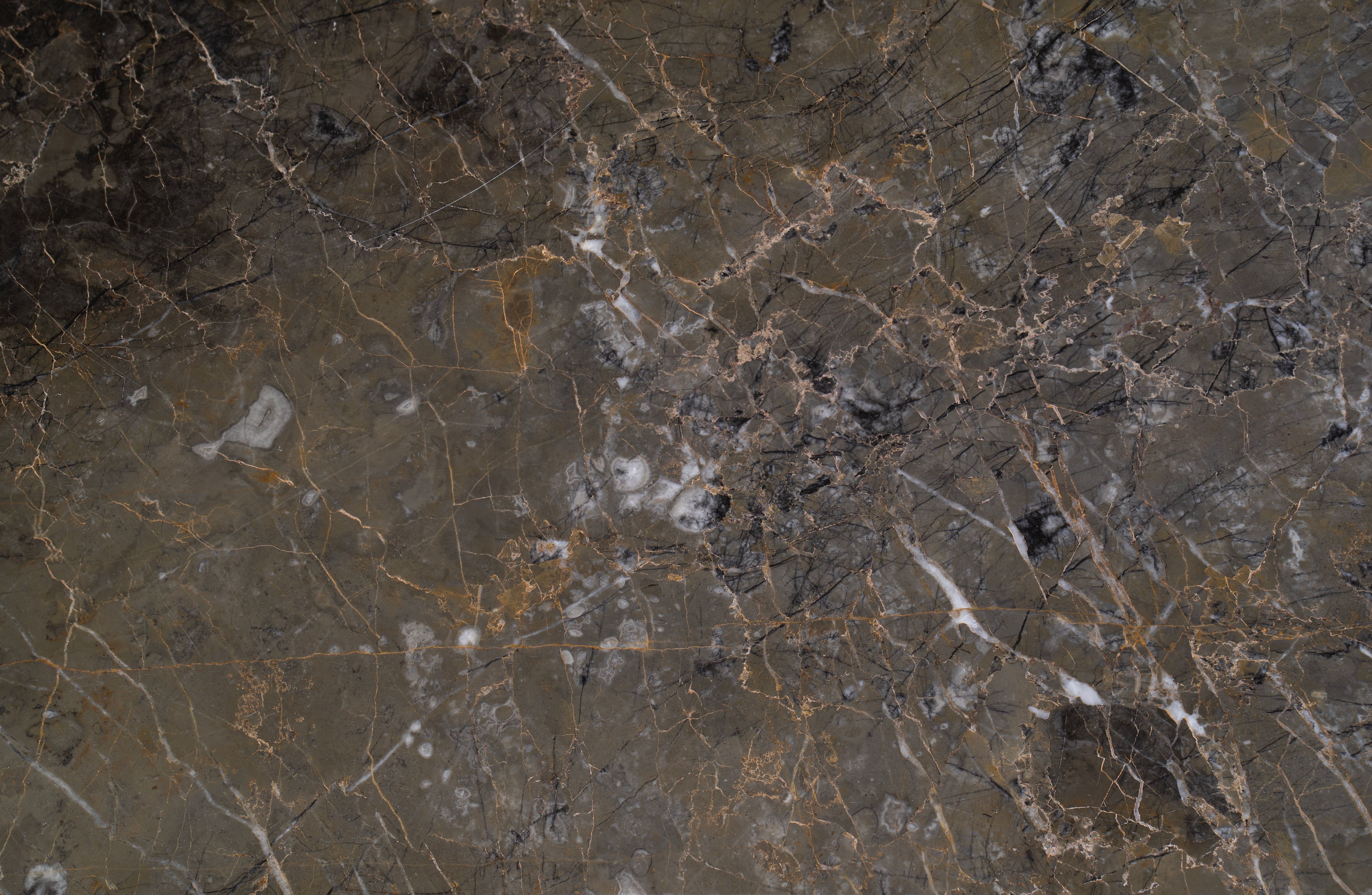 Stone; natural (excluding marble, travertine, alabaster, other calcareous stone or granite), monumental or building stone, (other than simply cut or sawn, with a flat or even surface)