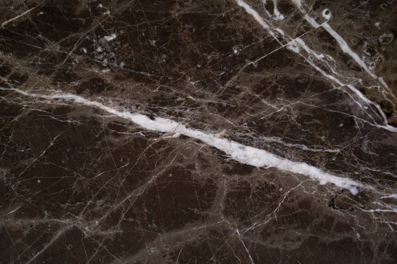 close up of a dark carnico marble surface showcasing intricate natural