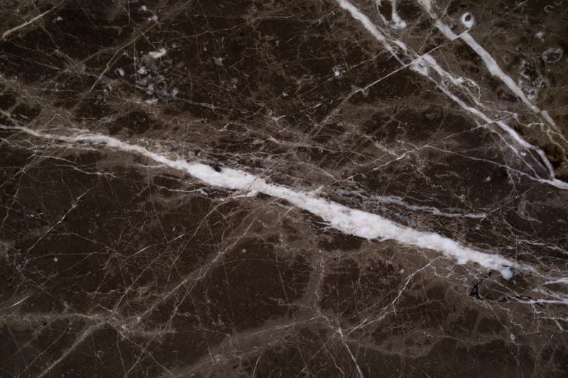 Soapstone surface — deep charcoal tone with natural mineral pattern