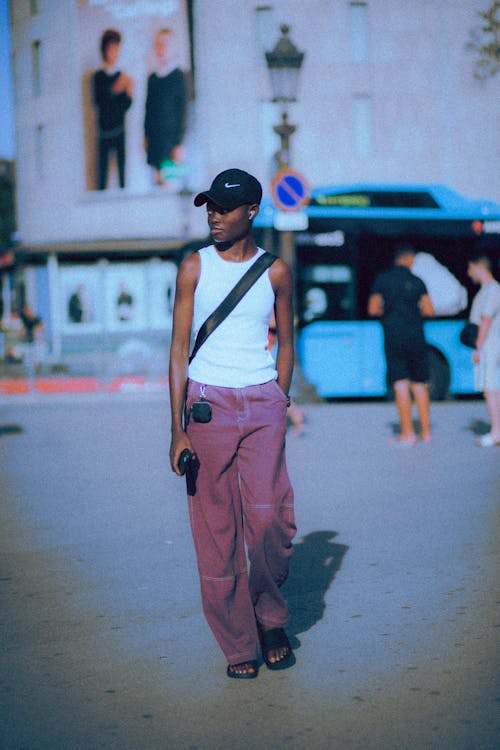 A Fashionable Young Man Walking on the Street 