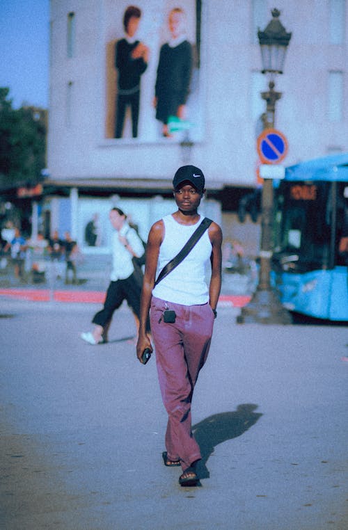 Young Black Woman in Casual Clothes Walking on City Street