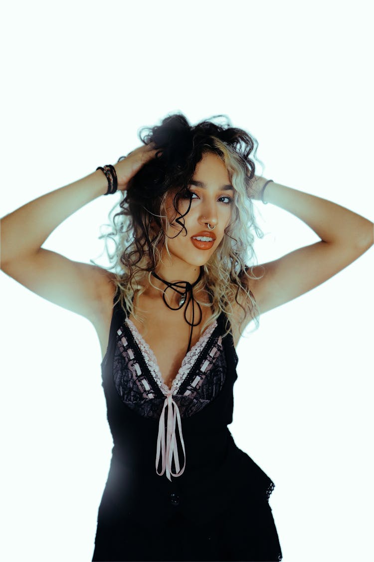 Young Woman Posing On White Studio Background