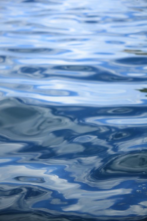 Free Calm ocean water with sunlight reflections at Porto de Galinhas, Brazil. Stock Photo