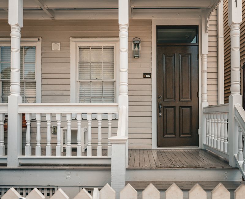 Home exterior with fresh landscaping and painted front door in Louisville