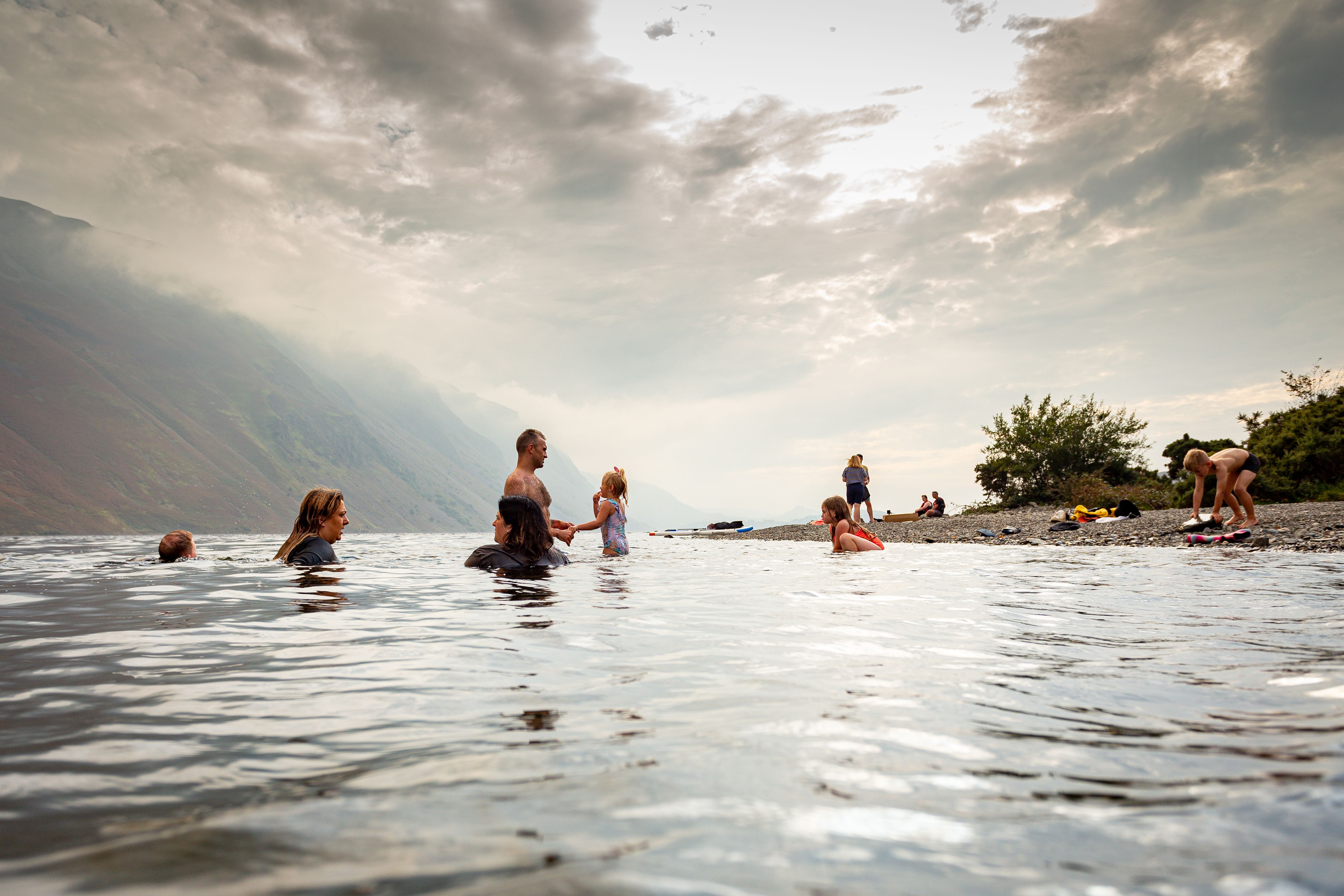 People Bathing in a Lake, and Clouds in Sky · Free Stock Photo