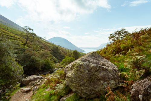 Free Explore a picturesque landscape at Wasdale Head featuring lush greenery, prominent rocks, and scenic mountain views. Stock Photo
