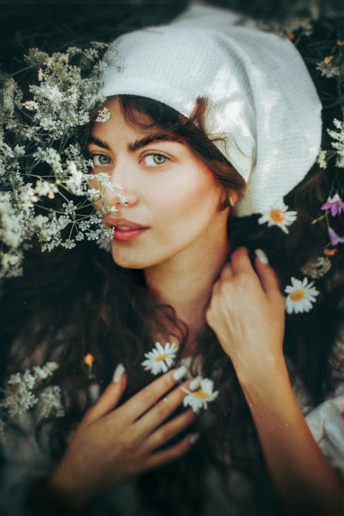 Free Portrait of a Woman with Wildflowers Stock Photo