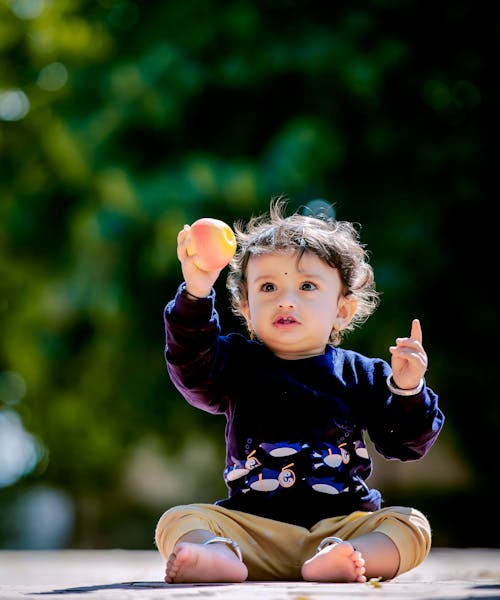 Little Boy in a Park in Sunlight 