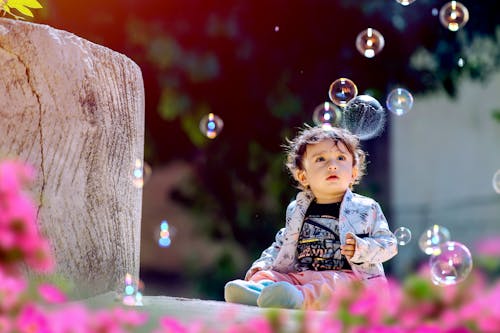 Child Focused at Soap Bubbles