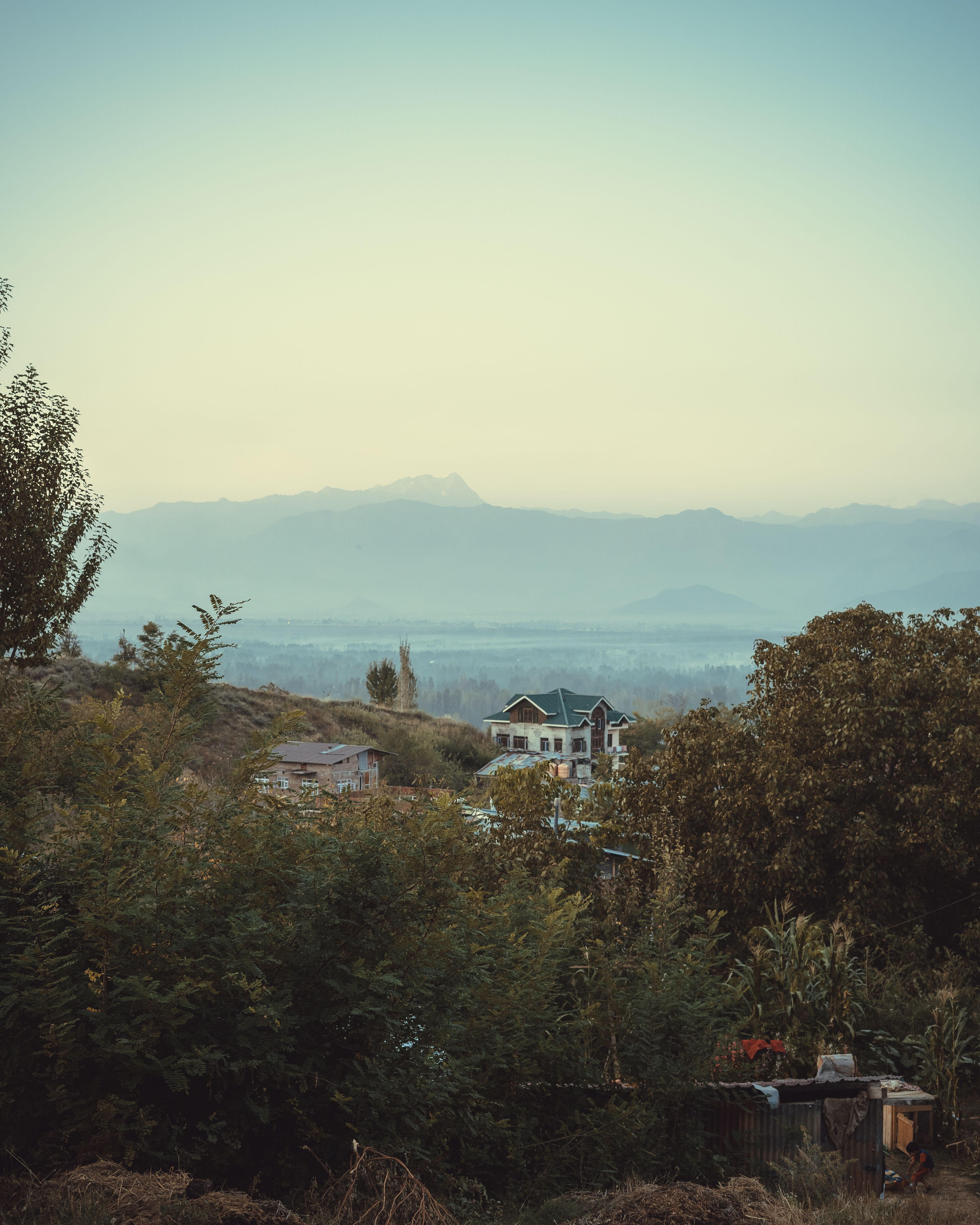 House Building in a Mountain Valley · Free Stock Photo