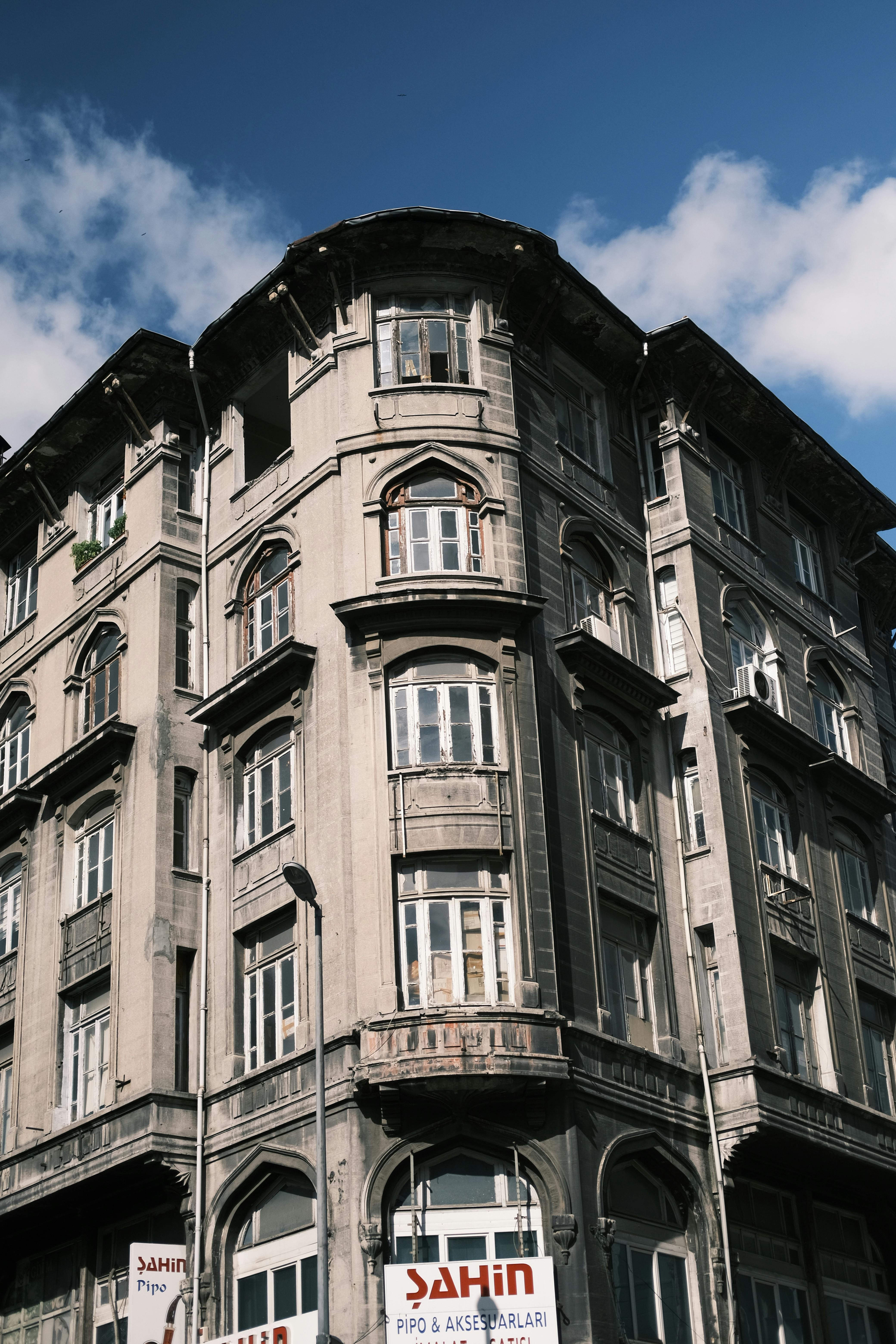Free Explore the intricate design of a classic Ottoman style corner building in Istanbul, Turkey. Stock Photo