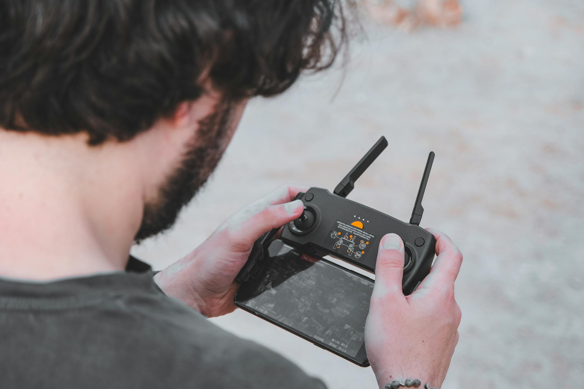 Man Holding a Remote Control Pilot