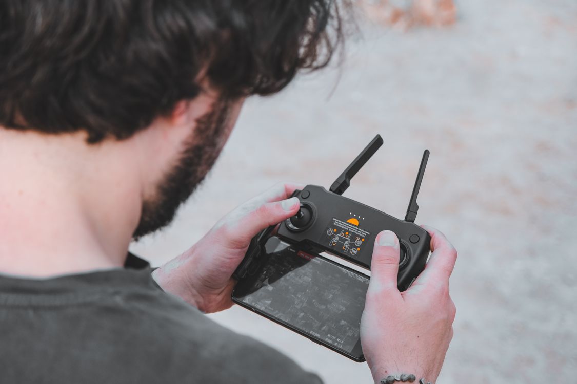 Man Remote Control Man Holding a Remote Control Pilot · Free Stock Photo