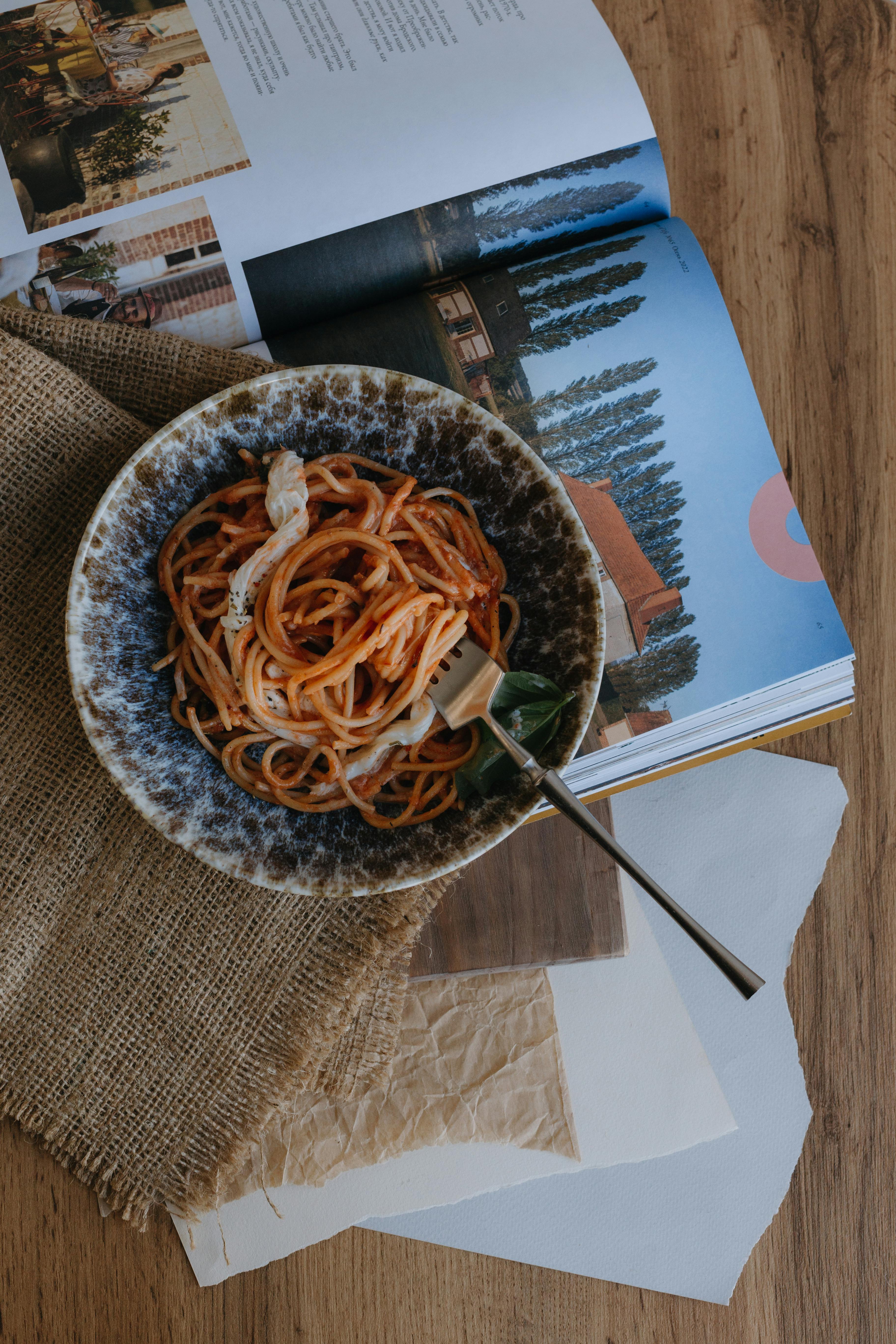 Spaghetti in Bowl on Book · Free Stock Photo