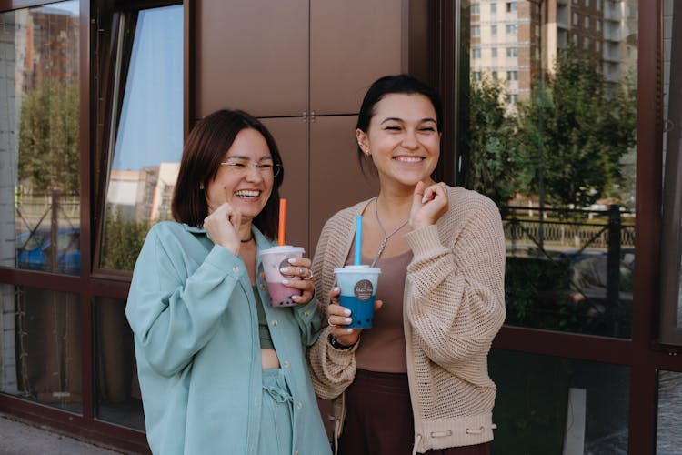 Two Happy Women With Cups Of Coffee