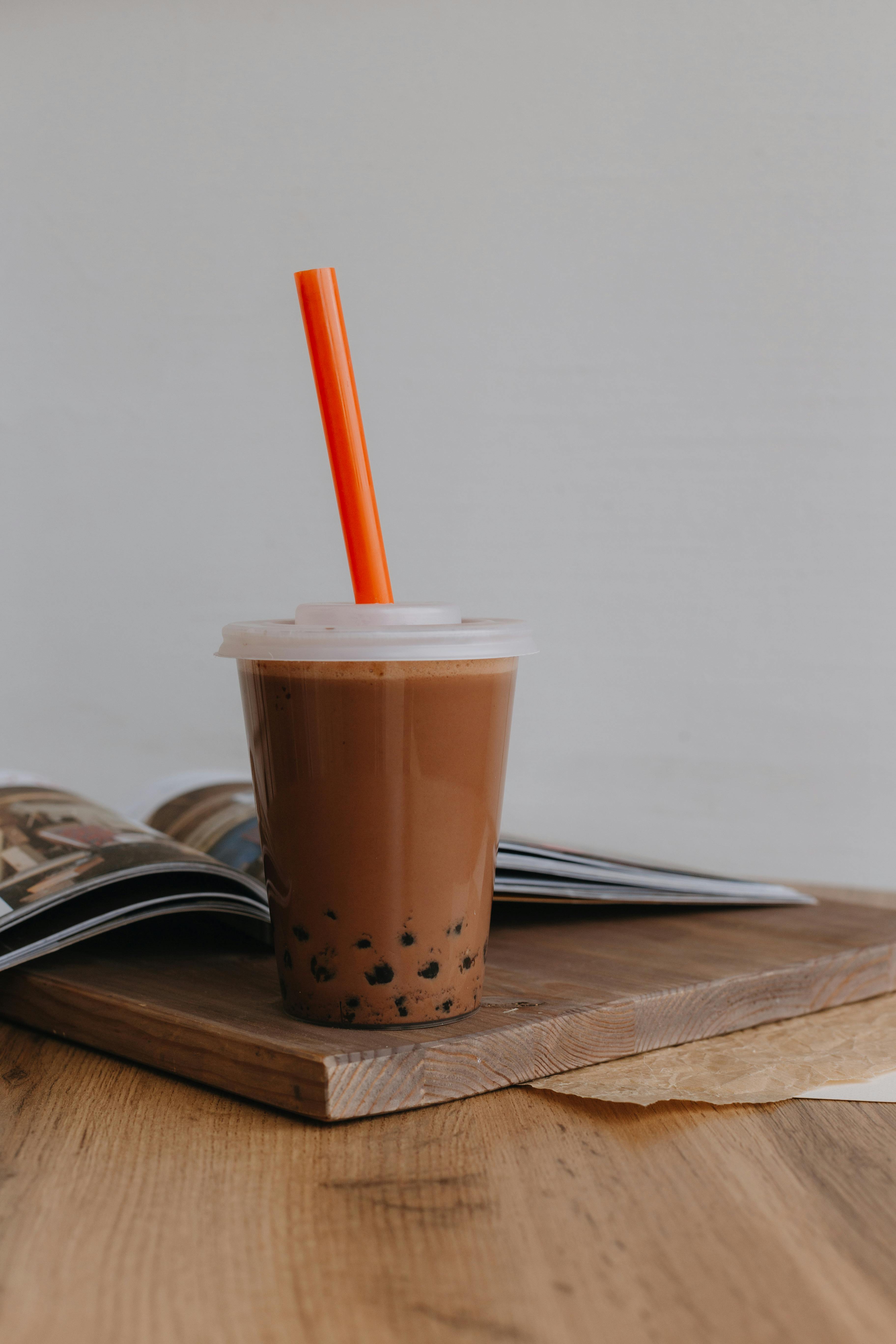 https://images.pexels.com/photos/18330454/pexels-photo-18330454/free-photo-of-iced-coffee-in-a-plastic-cup.jpeg
