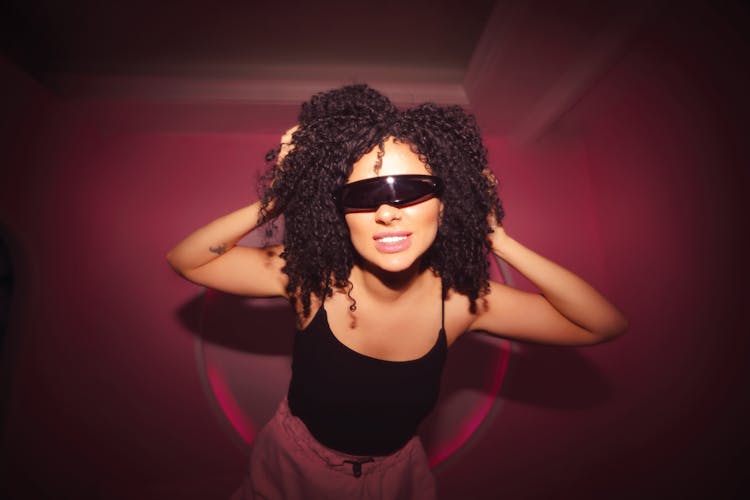 Dancing Young Woman In Sunglasses