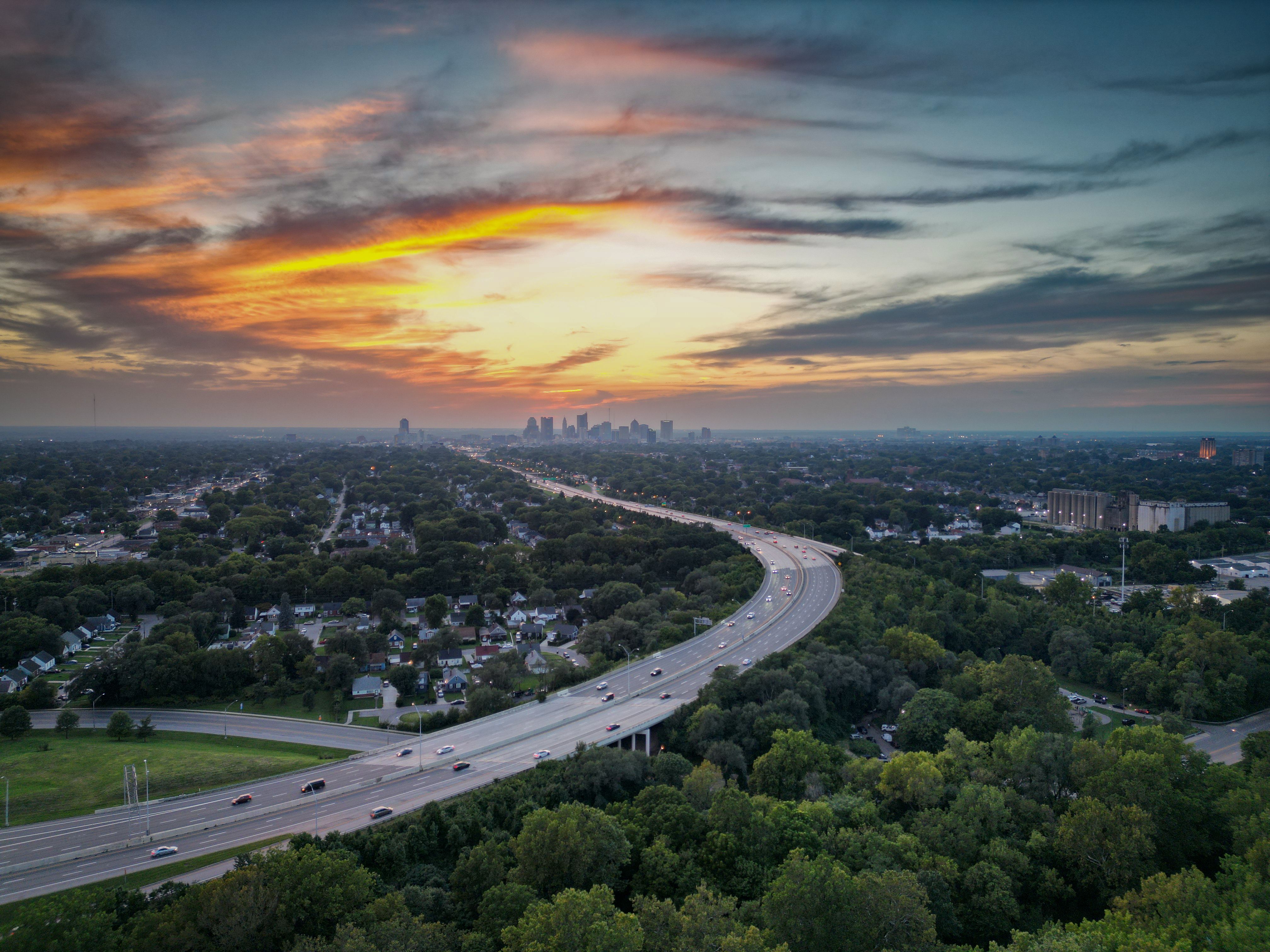 Highway Leading to the City Center in the Light of the Setting Sun ...
