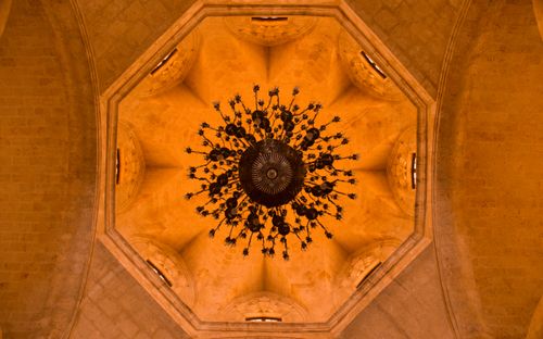 Free Intricate chandelier view from below within a baroque dome, showcasing rich architecture. Stock Photo
