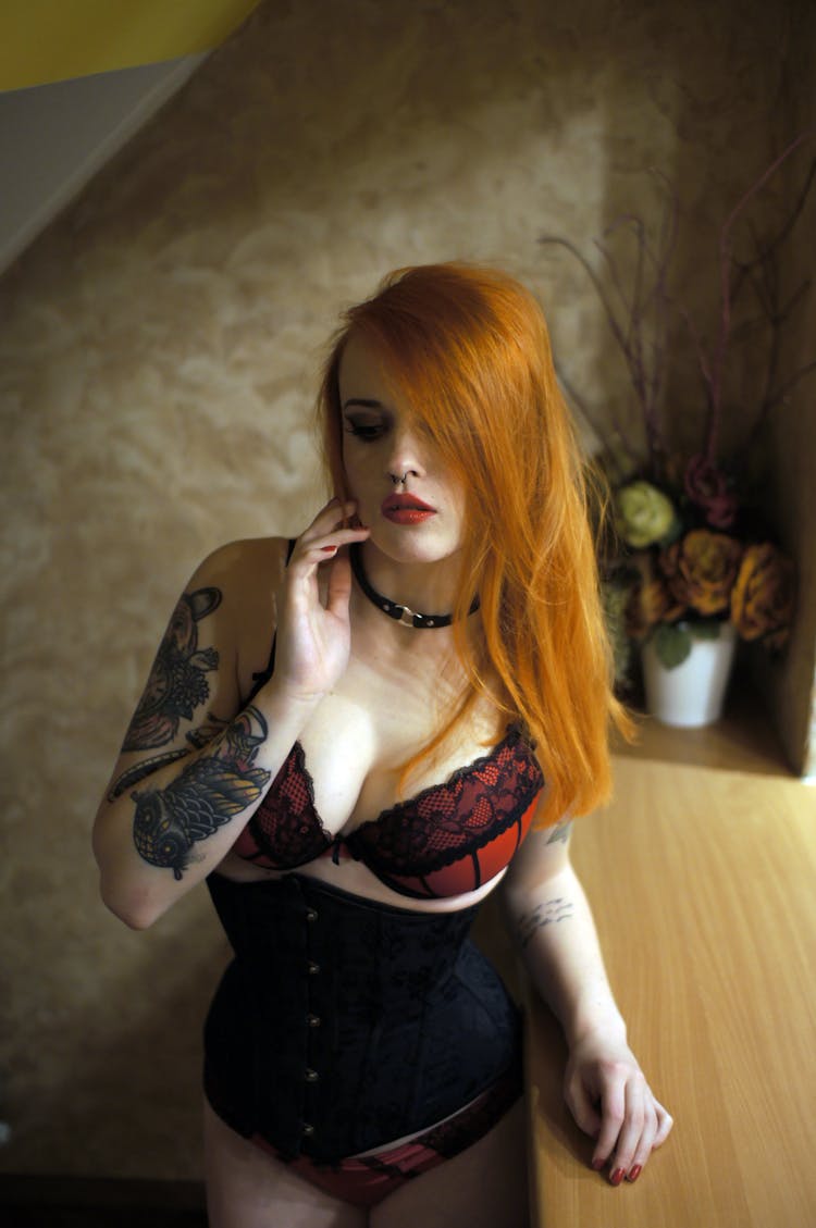 Young Redhead Posing In Lingerie