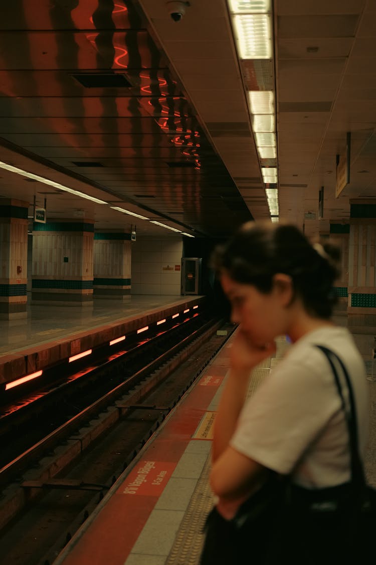 Woman Waiting On Metro Station